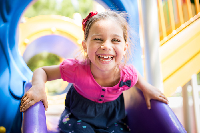 Little Girl Playing At Playground at a Preschool & Daycare Serving North Hollywood & Santa Monica, CA