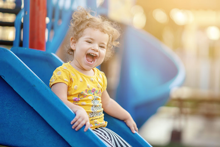 happy Toddler Playing At Playground at a Preschool & Daycare Serving North Hollywood, Santa Monica & Van Nuys, CA