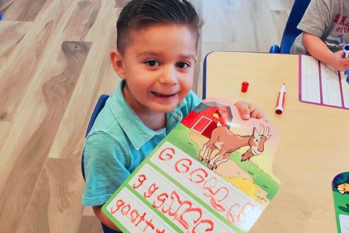 happy boy learning letters at a Preschool & Daycare Serving North Hollywood & Santa Monica, CA