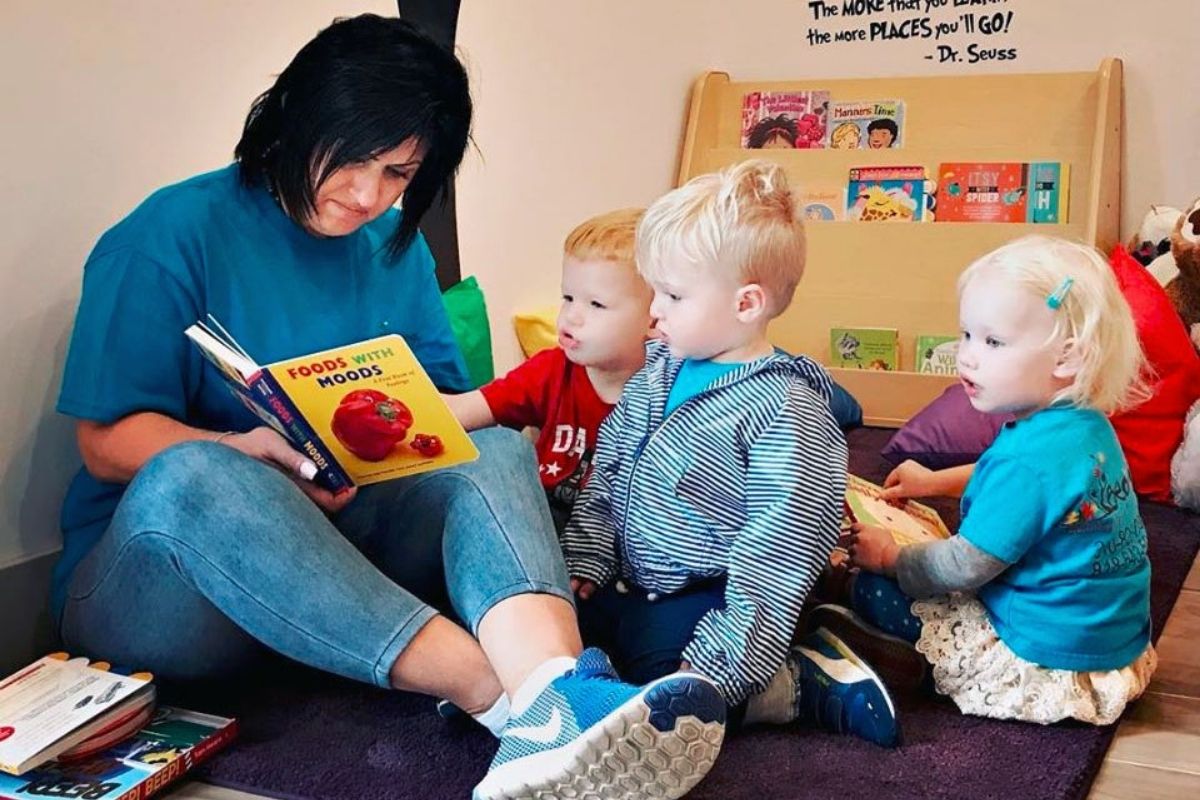 Teacher reading to toddlers at a Preschool & Daycare Serving North Hollywood & Santa Monica, CA